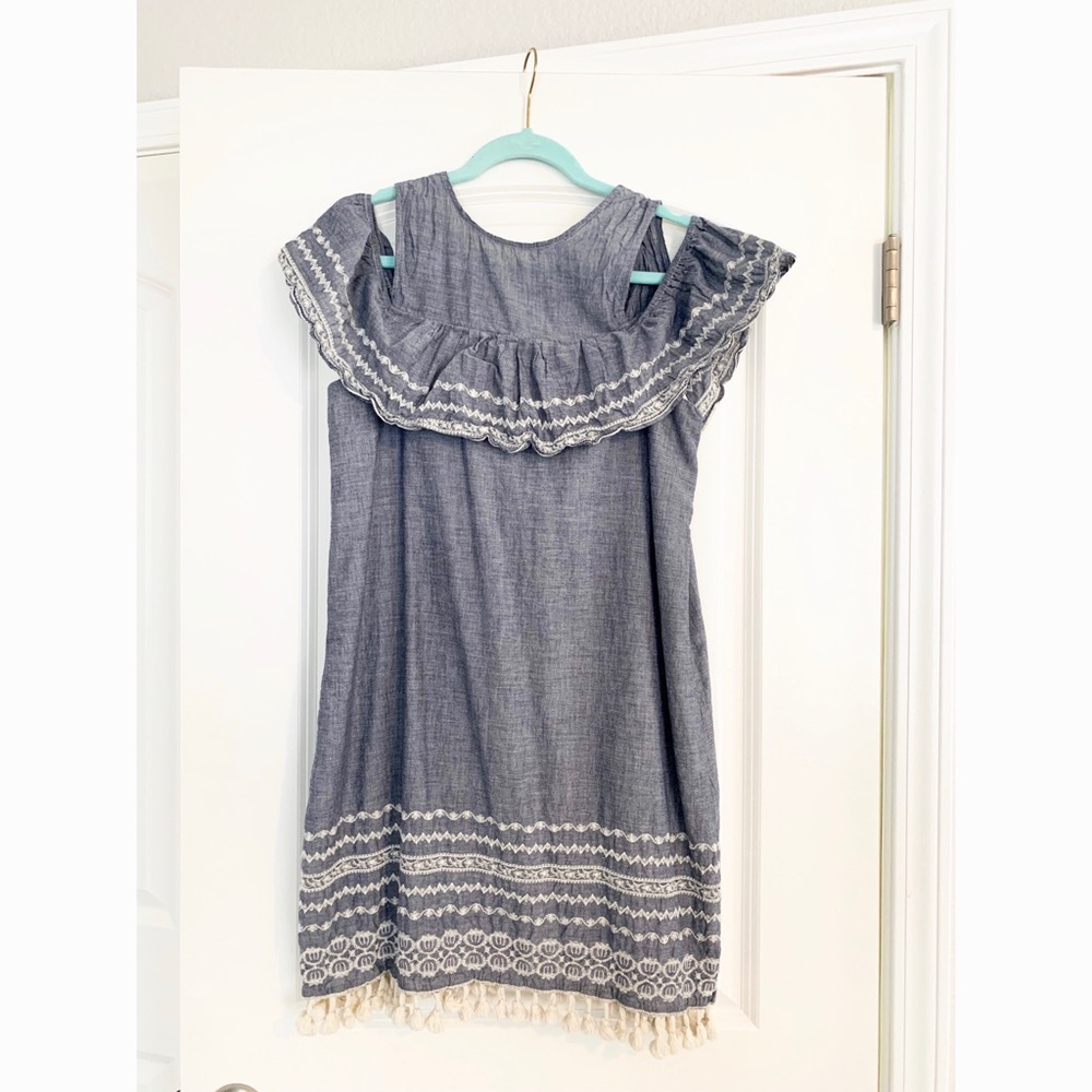 Francesca’s open shoulder tassel dress